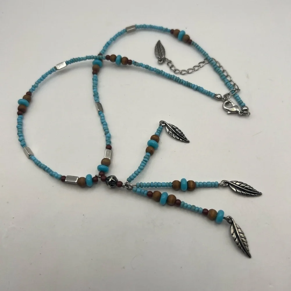 Avon Turquoise color seed pearls feather drop necklace